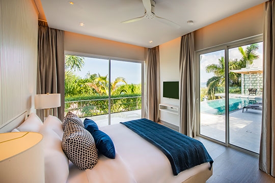 Guest bedroom one overlooking to the pool